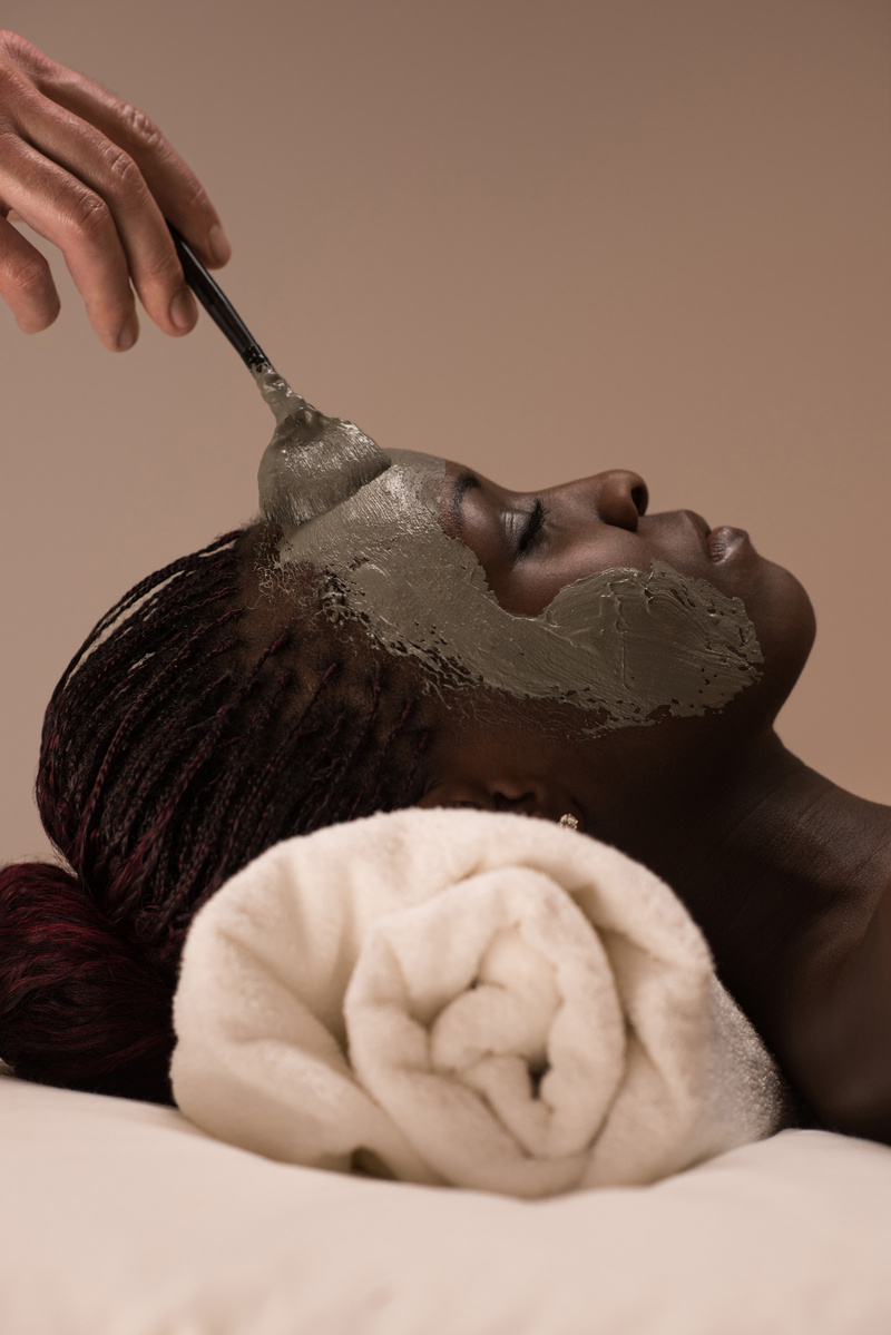 African Woman Having Clay Facial Mask